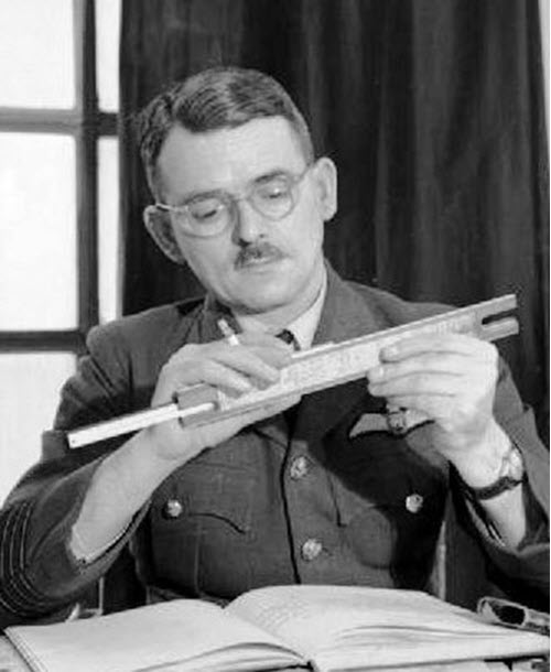 A picture of Frank Whittle adjusting a slide ruler