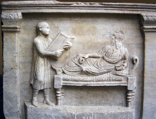 4th century sarcophagus relief of Valerius Petronianus, with his slave holding writing tablets