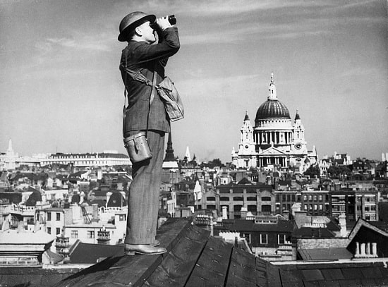 An Observer Corps spotter scans the skies of London