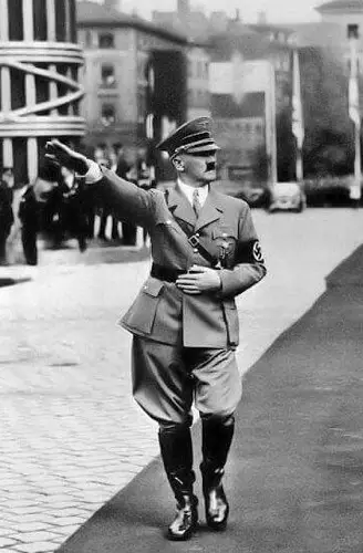 Hitler performs the Nazi salute at a rally