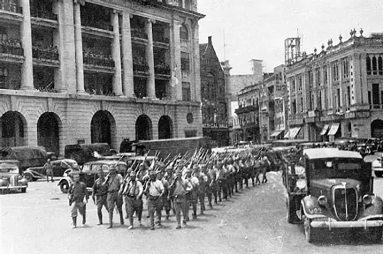 Japanese victorious troops march through the city center, Battle of Singapore