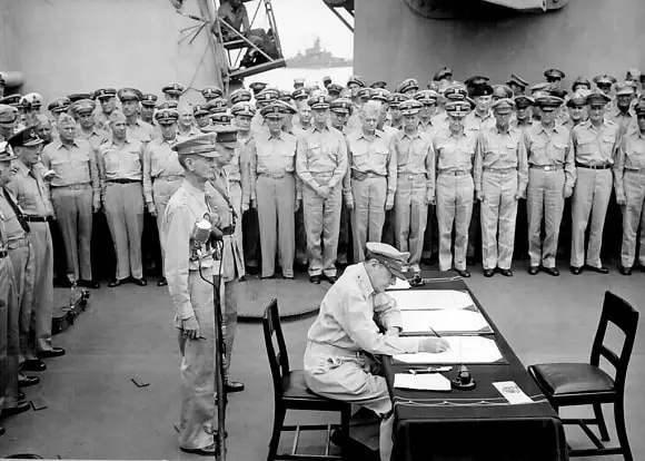 MacArthur Signs the Japanese Instrument of Surrender aboard the USS Missouri
