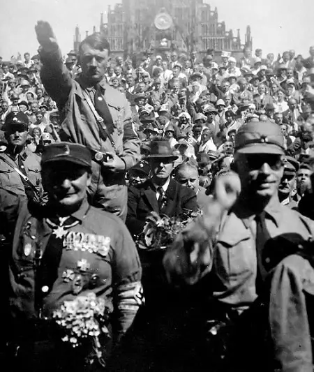 Hitler in rally doing Nazi salute
