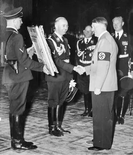 Heinrich Himmler presents Hitler with a gift