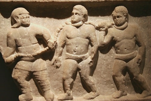 Relief depicting a Roman soldier leading captives in chains