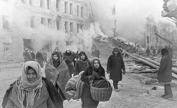 Soviet civilians leaving destroyed houses