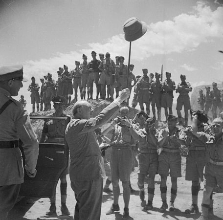 Winston Churchill Salutes allied troops in roman amphitheater Carthage, June 1943