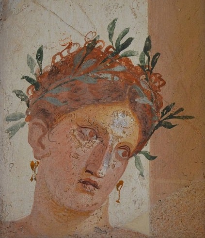 Ancient roman painting of woman with red hair wearing a garland