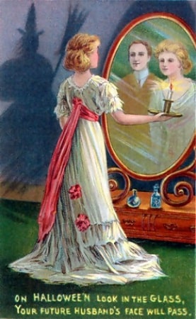 1904 Halloween greeting card, young woman hopes to catch a glimpse of her future husband