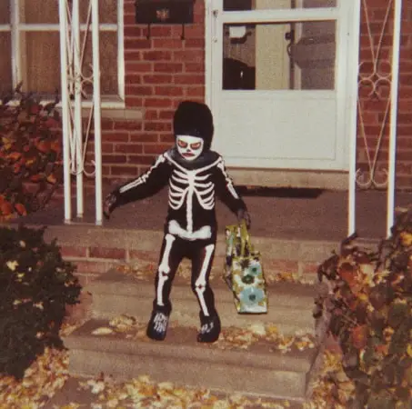 A child dressed as a skeleton trick or treating in Redford, Michigan